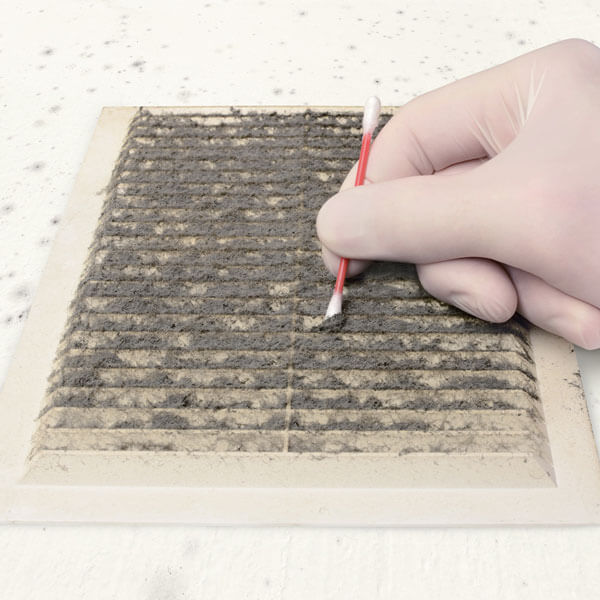 gloved hand swabbing dirty air vent